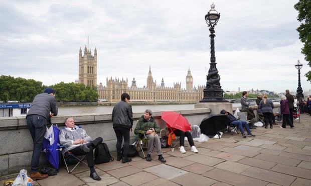 Members of the public queue on the South Bank, as they wait to view the coffin of Queen Elizabeth II lying in state.