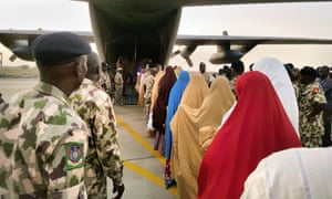 Schoolgirls kidnapped from Dapchi board a military plane following a handover to government officials in Maiduguri on 21 March.