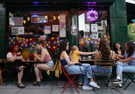 Women sitting outside drinking
