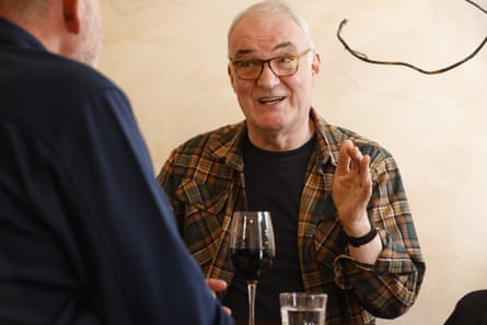 Terry chatting to Geoff at a restaurant table