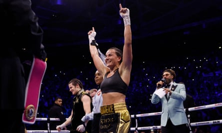 Chantelle Cameron celebrates by raising her hands in the air after she was announced as the winner of the fight.