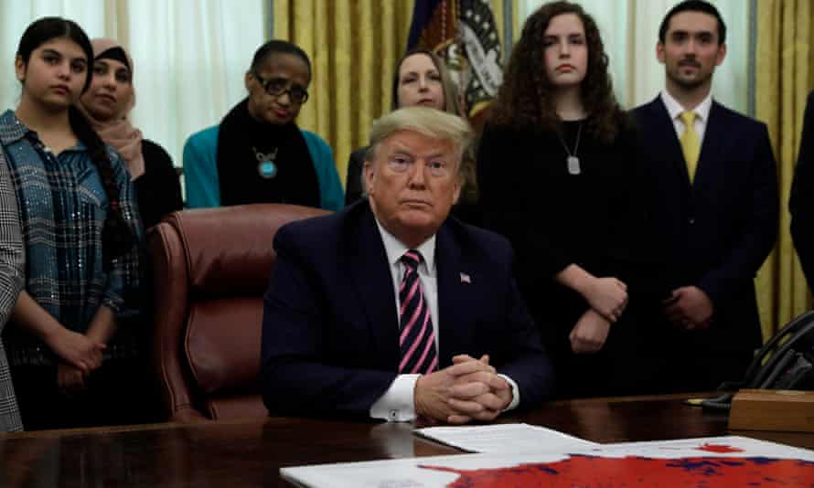 US President Donald J Trump reacts during the announcement of the Guidance on Constitutional Prayer in Public Schools in the the Oval Office at the White House in Washington, DC
