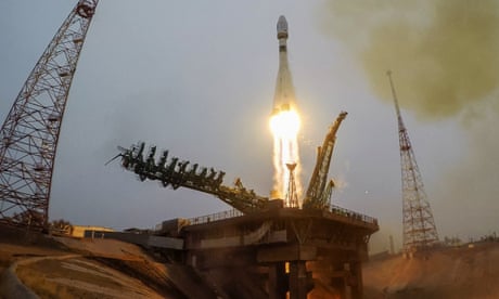 A Soyuz rocket blasts off into space carrying 38 satellites from 18 countries.
