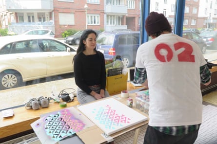 Street artist Emess at Schau Fenster, with co-organiser Samsarah Lilja
