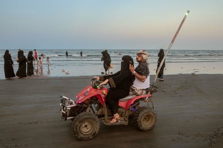 Partying on the beach, riding horses, quad biking, flying a kite, swimming, or just walking and chatting, seems to be the only leisure time for tired people, Yemen, 2021
