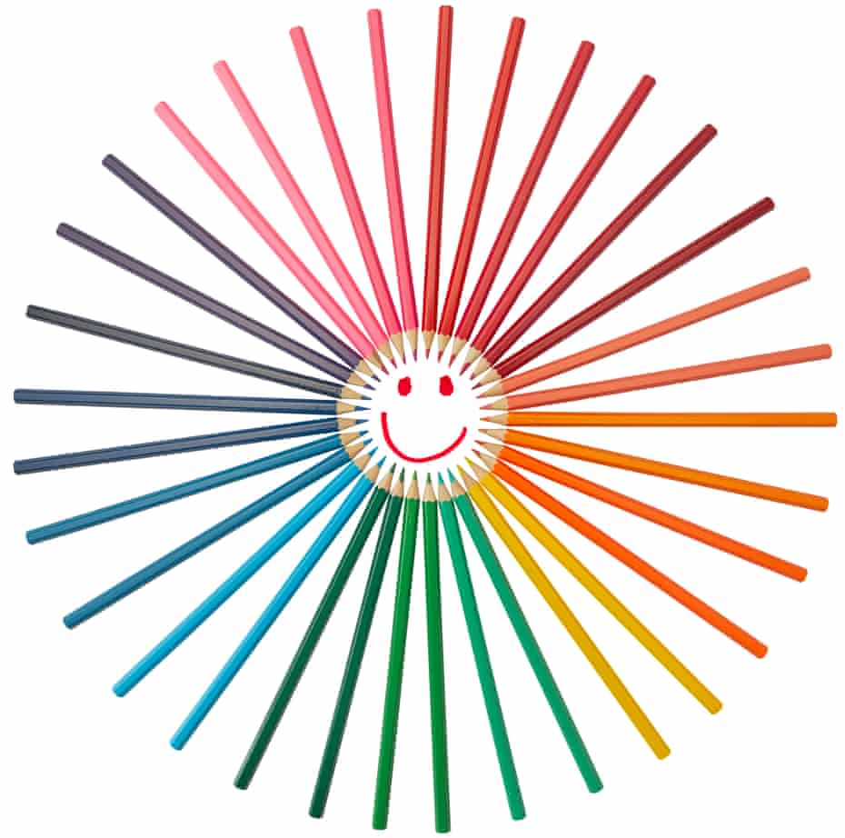 Photograph of smiley face with coloured sticks around it