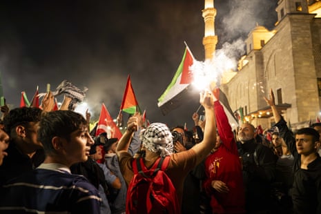 Pro-Palestinian supporters hold a rally in Istanbul, Turkey, on Saturday night.