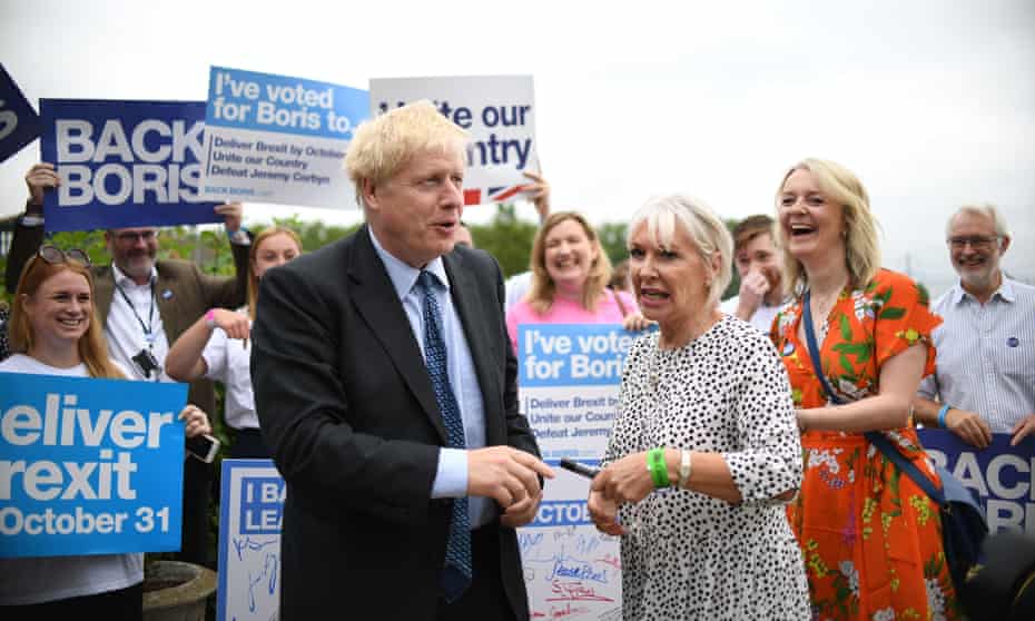 Johnson with Nadine Dorries and Liz Truss during a Tory leadership hustings in 2019
