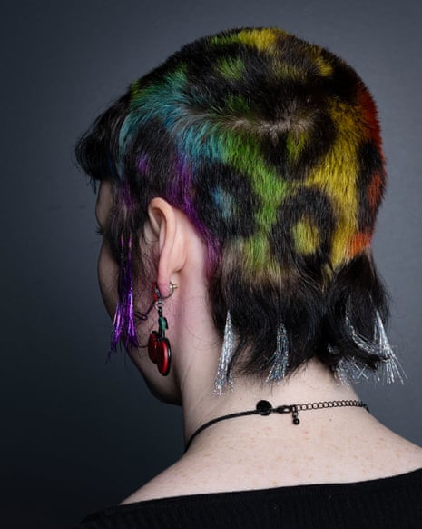 Short hair coloured in rainbow leopard pattern with mullet and sideburns