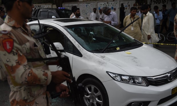 A bullet-riddled car in the Liaqatabad area of Karachi, after the gun attack on Amjad Sabri.