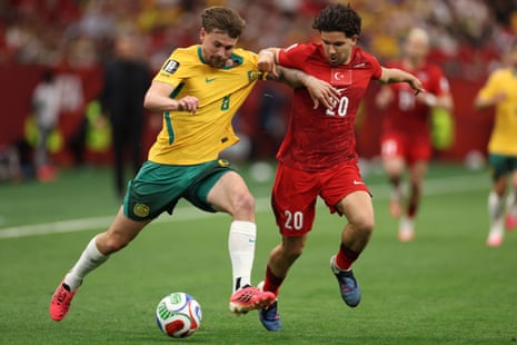 Connor Metcalfe #8 of Australia and Hakan Calhanoglu #10 of Turkiye compete for the ball