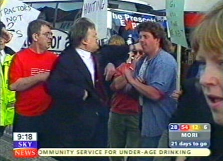 A screengrab of John Prescott, wearing a suit, punching a protester