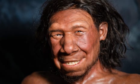 smiling man with tan skin and long dark hair