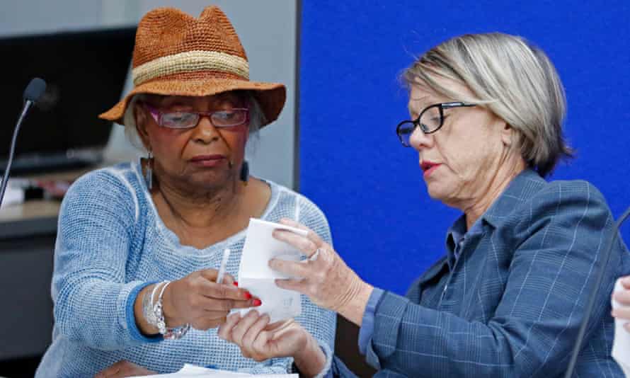 Brenda Snipes, left, speaks with Judge Betsy Benson, canvassing board chair, before the start of a recount of all votes in Broward county.