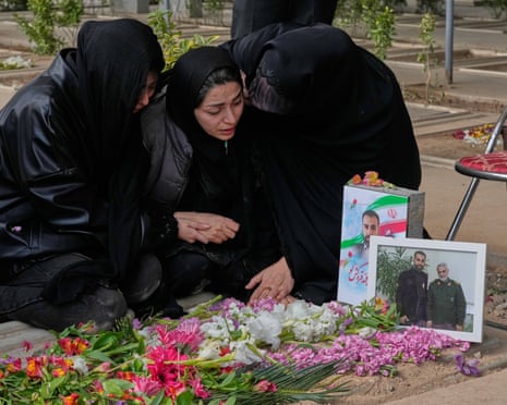 Relatives mourn a man who was killed in a US-Israeli strike in Tehran