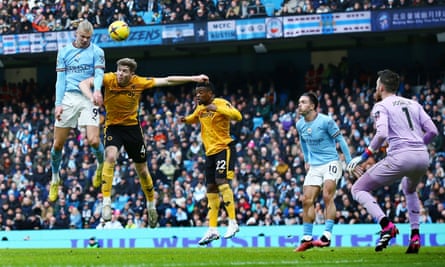 Haaland hat-trick sees off Wolves as Manchester City keep Arsenal in sights | Premier League 1 Erling Haaland rises to win a header for Manchester City against Wolves