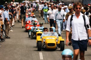 Children in miniature replicas of legendary race cars
