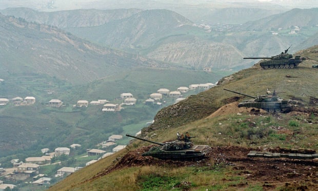 Russian T-80 tanks prepare to fire on the Dagestani village of Karamakhi, 1999.