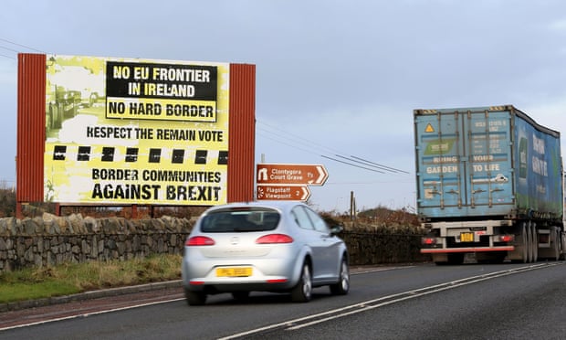 Traffic passes a Brexit Border poster on the Dublin road Co Armagh border, between Newry in Northern Ireland and Dundalk in the Irish Republic