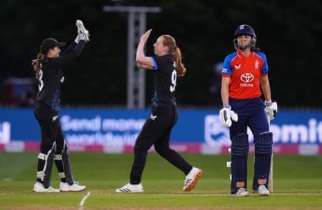 England's Maia Bouchier walks after being bowled by New Zealand's Bree Illing.