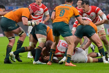Ben Gunter (obscured) scores Japan's second try