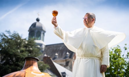 Norbertine Father Karel toasts with a Grimbergen beer.