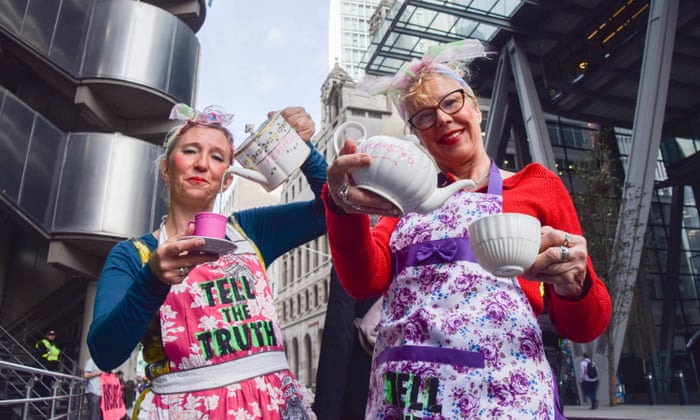 Protesters dressed as tea ladies pour ‘realitea’ and ‘honestea’ outside Lloyd’s headquarters in the City of London.