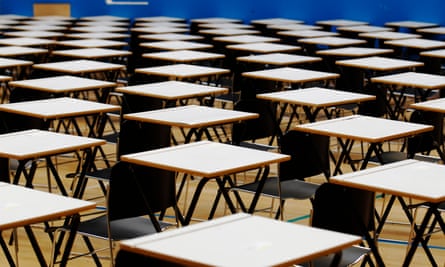 Rows of empty desks in an exam hall