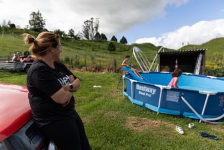 Raewyn Sinclair supervises her children as they play outside in their back yard in Raetihi.