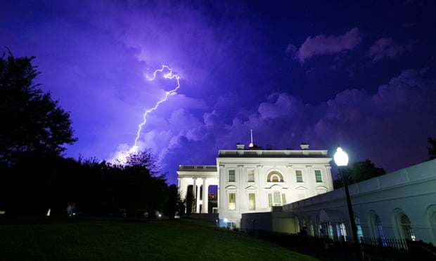 A file photo showing a bolt of lightning illuminating the clouds behind the White House.