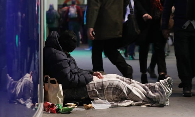 Man sleeping on street.