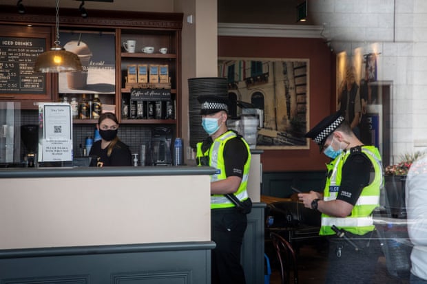 Police make checks in a coffee shop on Union Street