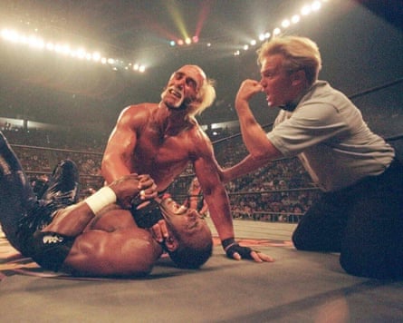 Hulk Hogan puts a choke hold on the neck of Utah Jazz basketball star Karl Malone at a pay-per-view wrestling match in July 1998 in San Diego.