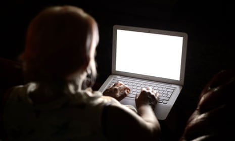 A woman using a laptop computer. 