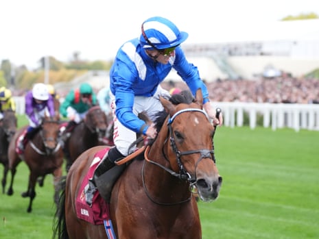 Tom Marquand on Almeraq celebrates crossing the finish line to win the race
