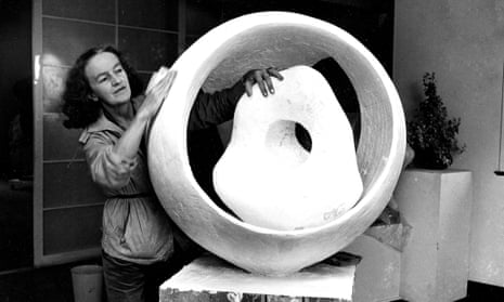 The British sculptor Barbara Hepworth pictured with her work Sphere and the Inner Form