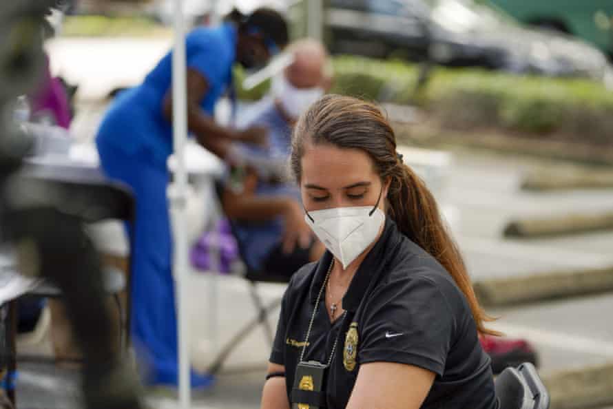Stefani L’Esperance, a detective in St Petersburg, Florida, waits 15 minutes after receiving her second dose of the Covid vaccine.