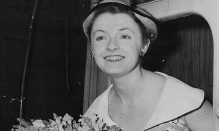 Jane Wenham leaning out of a train carriage as she and the rest of the Old Vic theatre company prepared to tour South Africa in 1952.