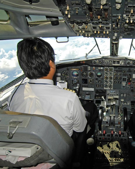 Pilots at work in their aircraft cockpit