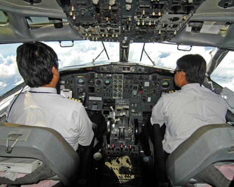 Pilots at work in their aircraft cockpit