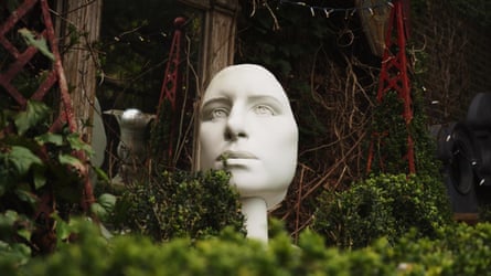 A faux marble bust of the face of Barbra Streisand.