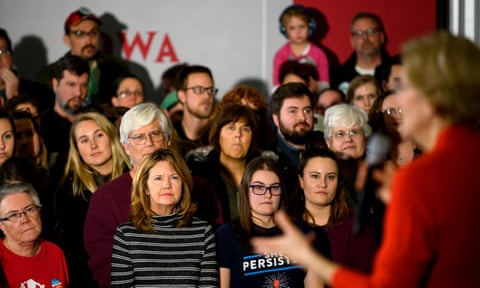 People listen to Elizabeth Warren at a campaign stop in Cedar Rapids, Iowa on 26 January 2020.