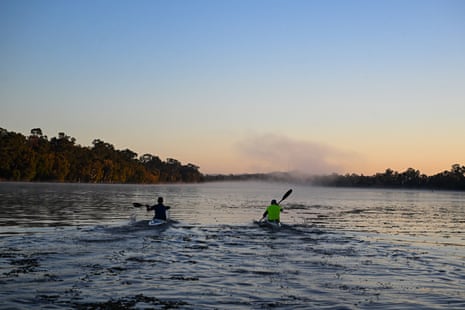 Scott Lawton and Andrew Miller paddle along the Fitzroy River, a potential Olympic site despite concerns over increasing crocodile numbers.