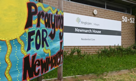 A sign saying Pray for Newmarch house outside the home