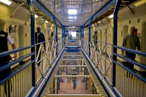 A view along wing A of Wandsworth prison, with suicide netting above.