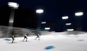 Athletes compete during the cross country leg of the Nordic combined individual normal hill at the Alpensia ski jumping centre.