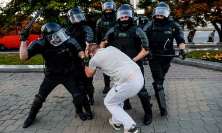 Police detain demonstrators during a protest on the day after the presidential election in Minsk, Belarus.