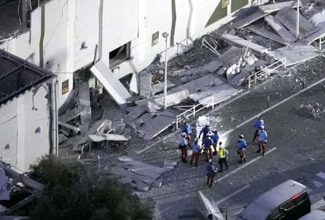 An aerial view shows rescue workers conducting a search and rescue operation at the damaged Aeon Mall shopping centre, where, according to local media, an explosion occurred after an earthquake with a preliminary magnitude of 7.1 struck Japan's southern Kumamoto prefecture, in Kashima Town, Kumamoto Prefecture, Japan, July 28, 2026.