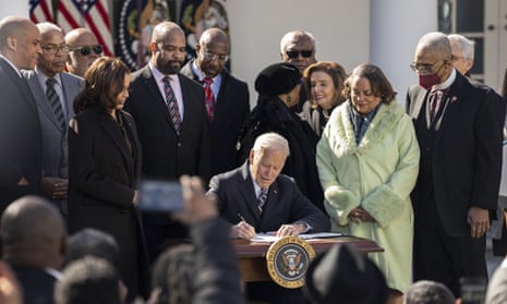 Joe Biden signs the Emmett Till Antilynching Act in the Rose Garden of the White House on Tuesday.