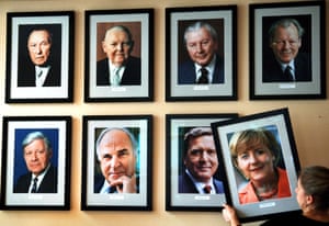 A portrait of Merkel is hung on a wall in a pub in Berlin, 2005